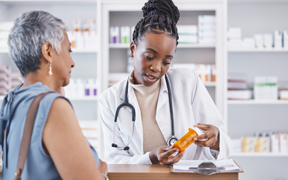 pharmacist-talking-to-elderly-woman-about-medication