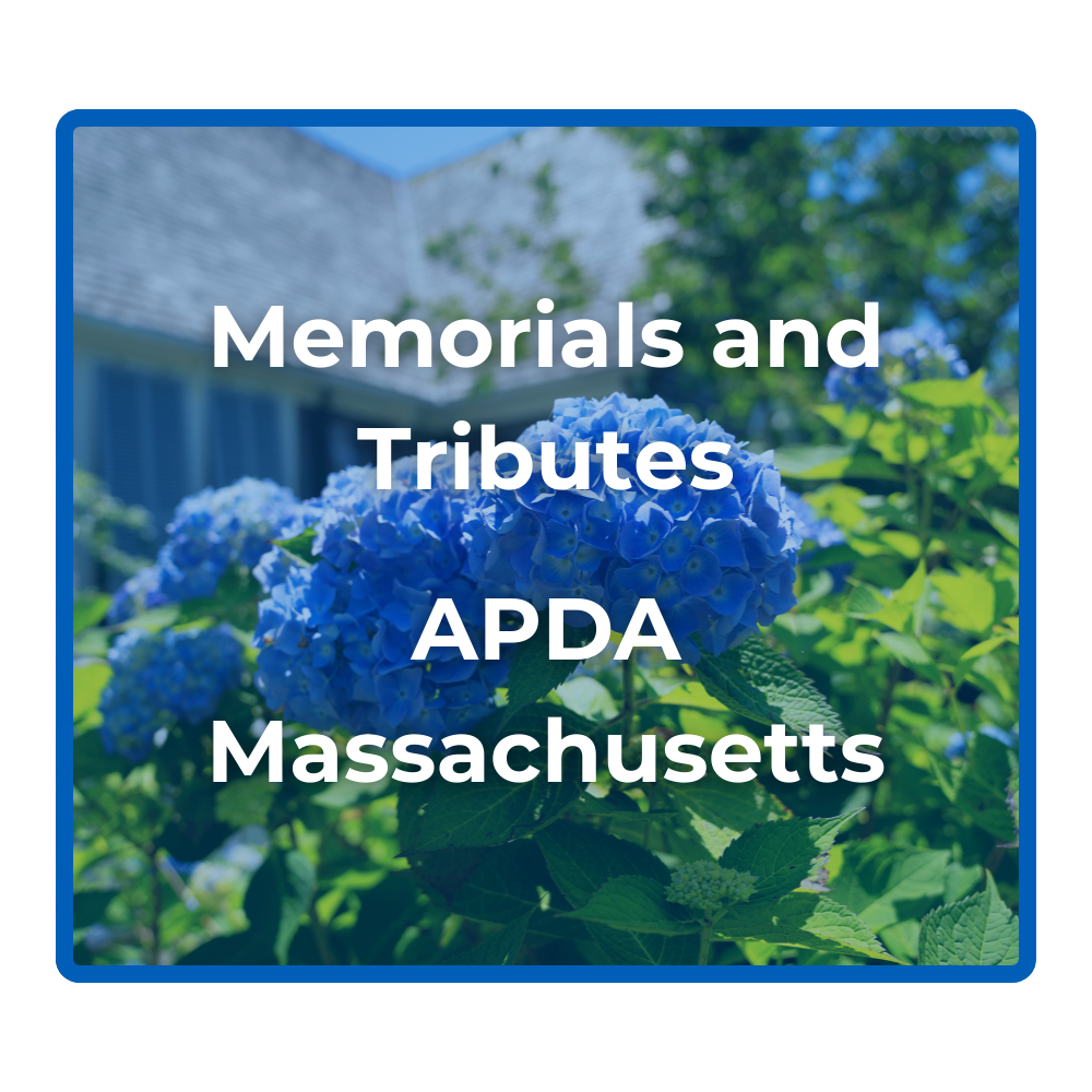 Memorials and tributes button with a photo of a Massachusetts native flowers
