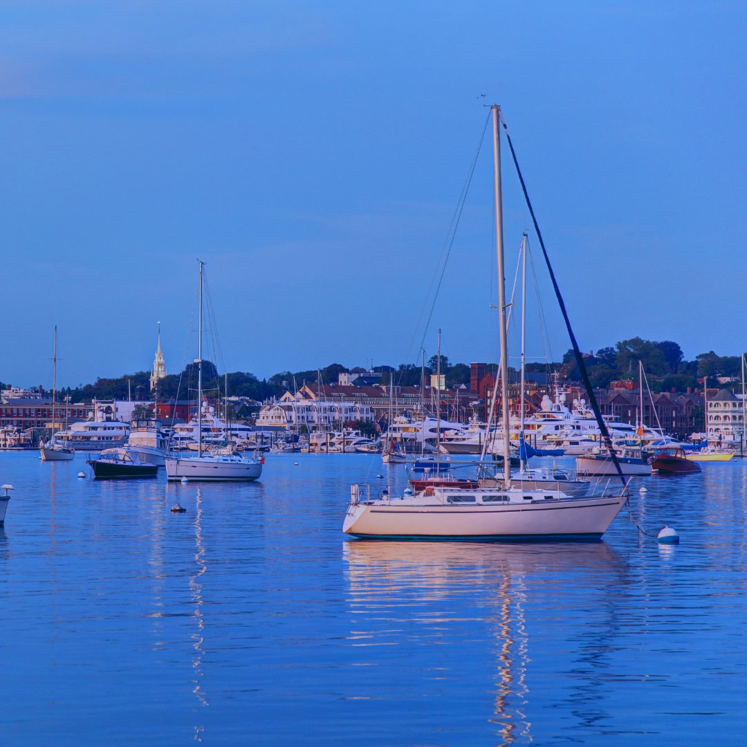 Give a monthly donation to the APDA Rhode Island Chapter.  Image of sail boats in a Rhode Island marina