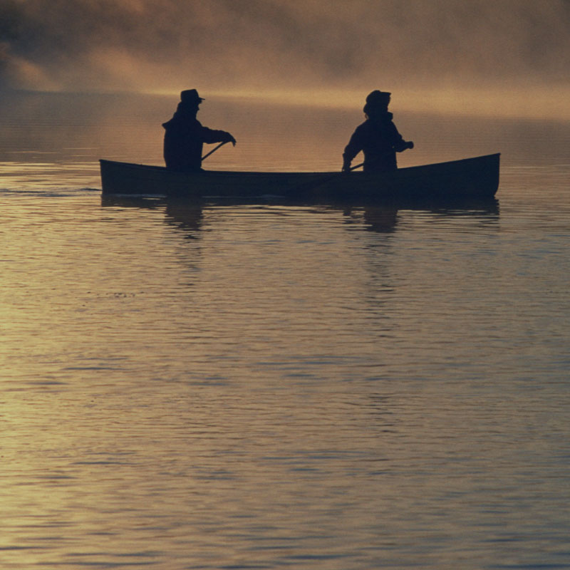 Donate monthly to the APDA Wisconsin Chapter - 2 people in a canoe on a Wisconsin lake