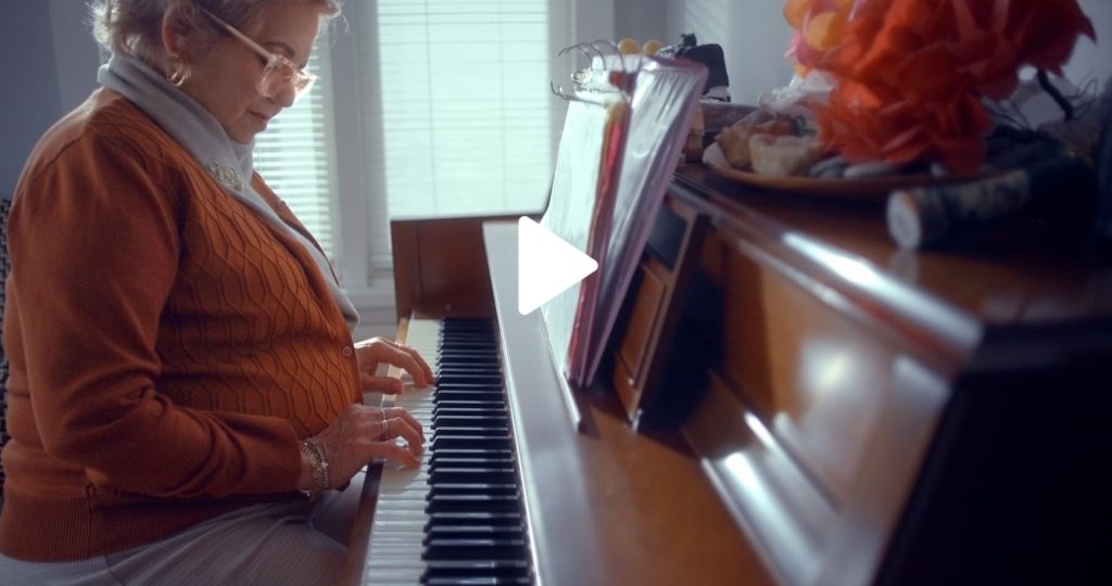 woman w/ parkinson's playing piano